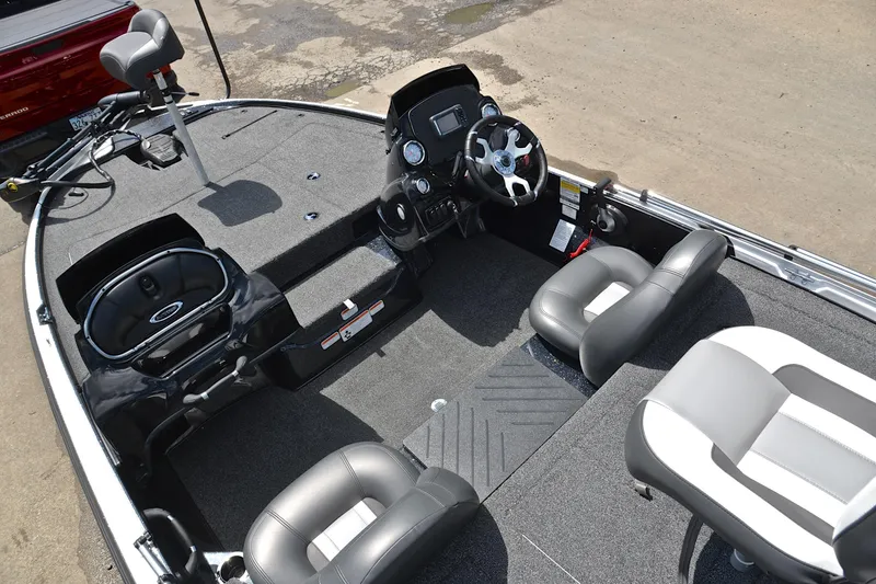 Slide: The Image of 2025 Nitro Z17 boat interior with steering wheel, seating, and fishing deck. - 21