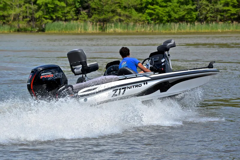 Slide: The Image of 2025 Nitro Z17 boat speeding on a lake, featuring a Mercury Pro XS engine. - 5