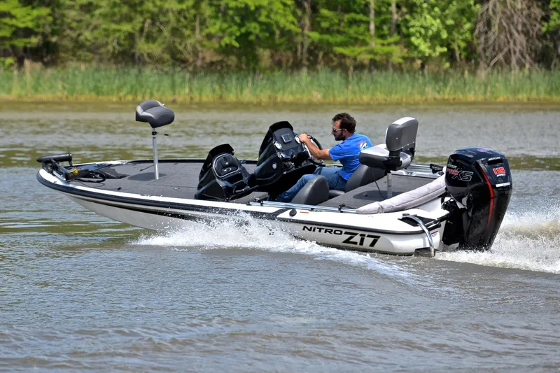 Slide: The Image of 2025 Nitro Z17 boat speeding on a lake with a person driving. - 6