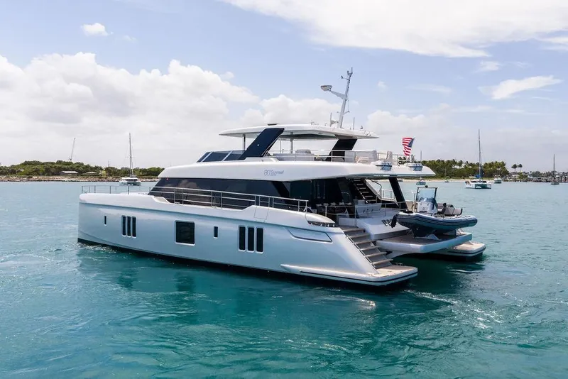 Slide: The Image of 2024 Sunreef 80 Power yacht on serene blue waters, showcasing luxury and elegance. - 10