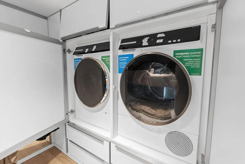Slide: The Image of Laundry appliances inside the 2024 Sunreef 80 Power yacht, featuring modern design and technology. - 105