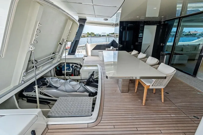 Slide: The Image of Luxurious 2024 Sunreef 80 Power yacht with jet ski storage and elegant outdoor dining area. - 108