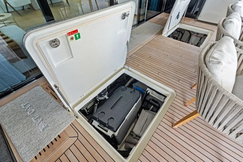 Slide: The Image of 2024 Sunreef 80 Power yacht deck with open storage compartment, showcasing modern design. - 111