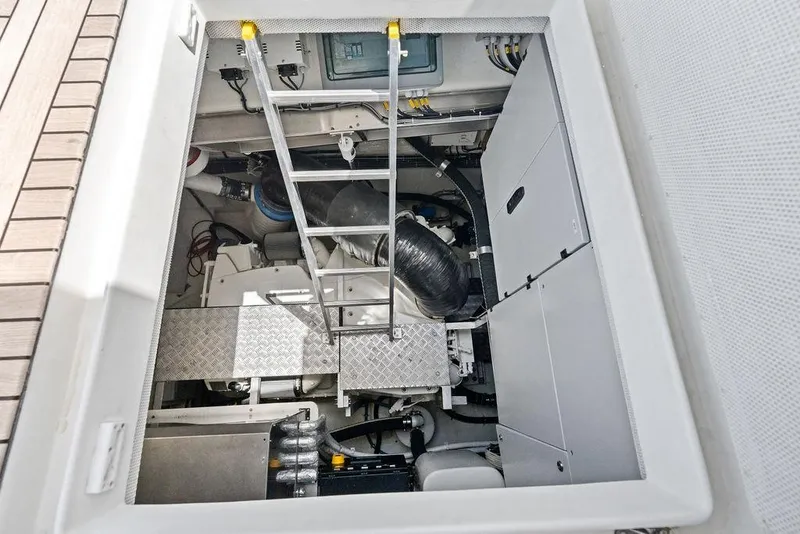 Slide: The Image of Engine room of 2024 Sunreef 80 Power yacht, featuring mechanical components and access ladder. - 114