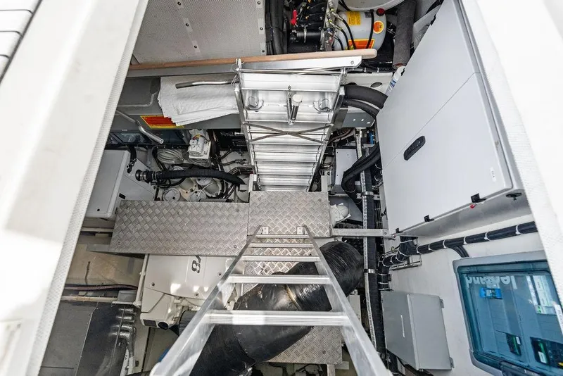 Slide: The Image of Engine room of 2024 Sunreef 80 Power yacht, featuring machinery and access ladder. - 118