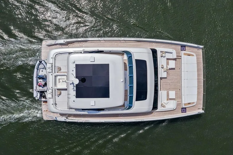 Slide: The Image of Aerial view of 2024 Sunreef 80 Power yacht cruising on water. - 15