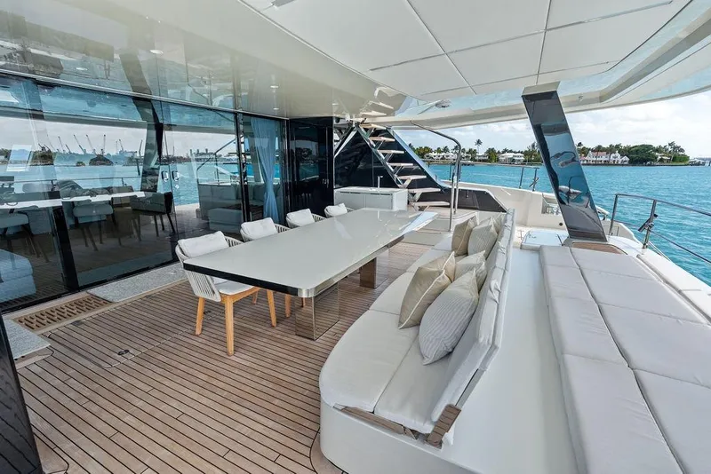 Slide: The Image of Luxurious Sunreef 80 Power yacht deck with elegant seating and ocean view, 2024 model. - 19