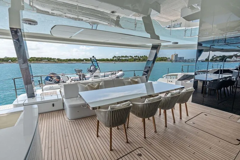 Slide: The Image of Luxurious Sunreef 80 Power yacht deck with elegant dining area, 2024 model. - 20