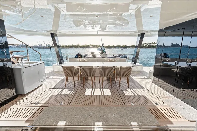 Slide: The Image of Luxurious 2024 Sunreef 80 Power yacht deck with elegant dining area and ocean view. - 21