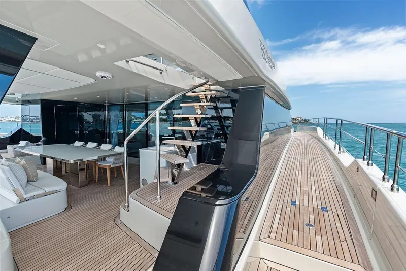 Slide: The Image of Luxurious 2024 Sunreef 80 Power yacht deck with elegant seating and ocean view. - 29