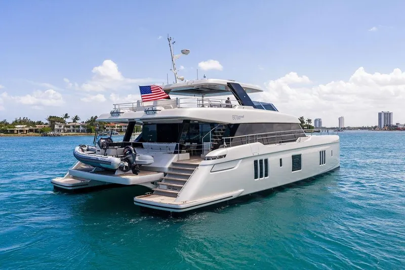 Slide: The Image of Luxurious 2024 Sunreef 80 Power yacht cruising in clear blue waters. - 3