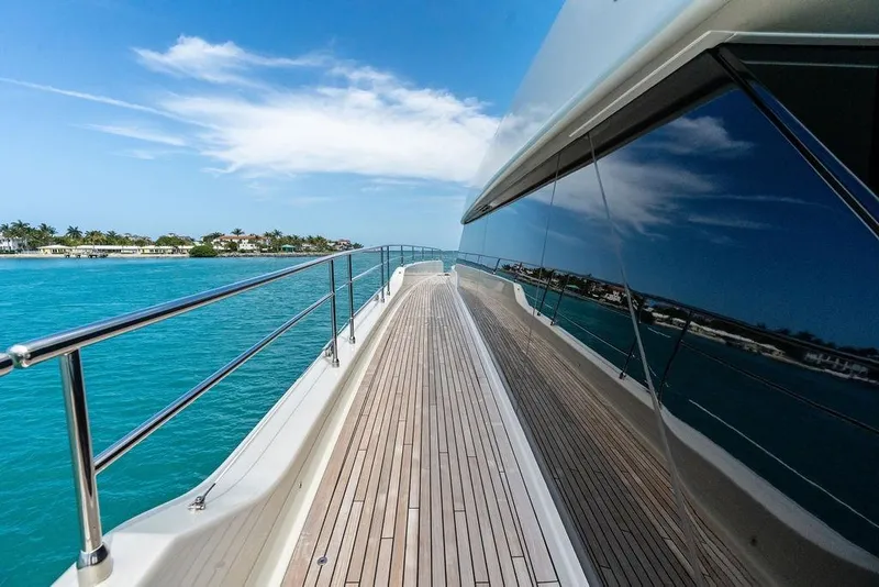 Slide: The Image of Luxurious Sunreef 80 Power yacht deck, 2024 model, cruising on clear blue waters. - 30