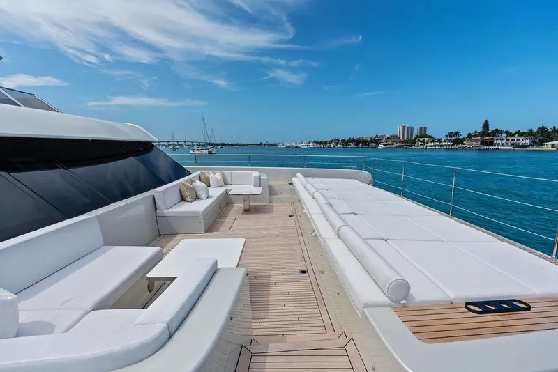 Slide: The Image of Luxurious Sunreef 80 Power yacht deck, 2024 model, with elegant seating and ocean view. - 32