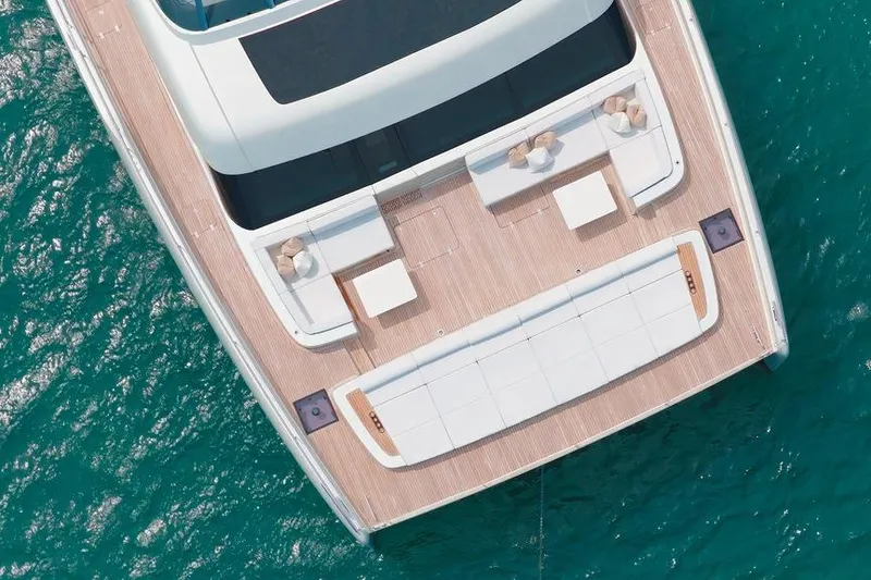 Slide: The Image of Aerial view of 2024 Sunreef 80 Power yacht's spacious deck on turquoise water. - 37