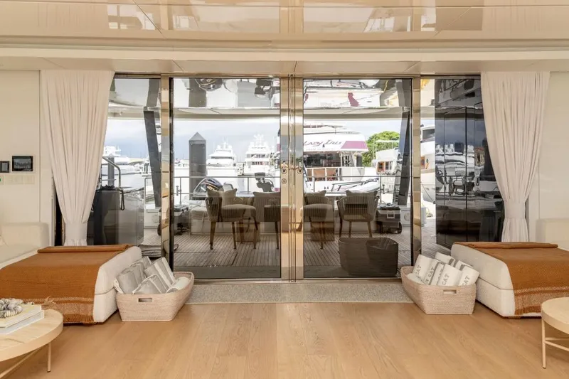 Slide: The Image of Luxurious interior of 2024 Sunreef 80 Power yacht with elegant seating and marina view. - 38