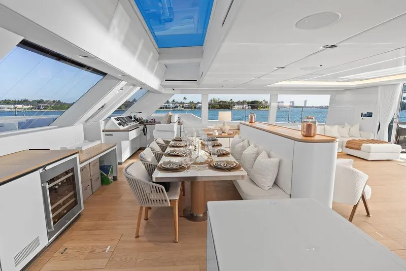 Slide: The Image of Luxurious interior of 2024 Sunreef 80 Power yacht with elegant dining area and ocean view. - 44