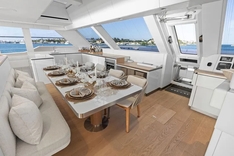 Slide: The Image of Luxurious dining area on 2024 Sunreef 80 Power yacht with elegant table setting and ocean view. - 46