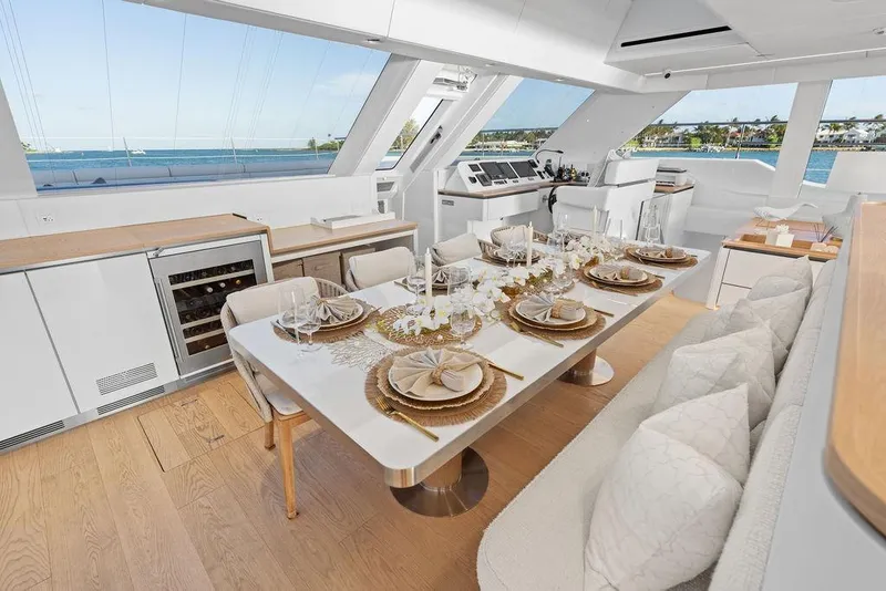 Slide: The Image of Luxurious interior of 2024 Sunreef 80 Power yacht with elegant dining setup and panoramic views. - 47