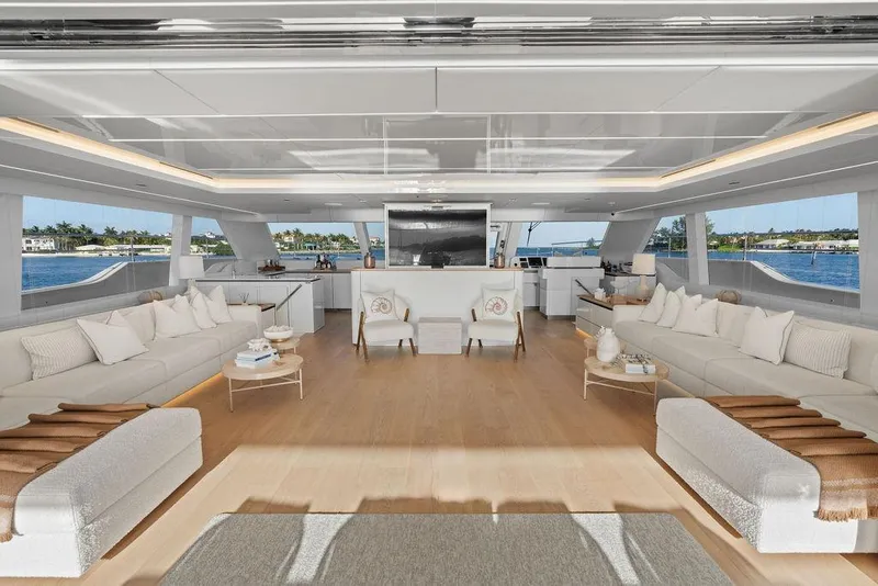 Slide: The Image of Luxurious interior of 2024 Sunreef 80 Power yacht with elegant seating and panoramic windows. - 52