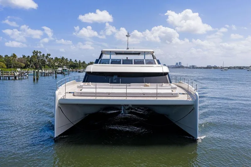 Slide: The Image of 2024 Sunreef 80 Power yacht on calm water, clear sky background. - 6