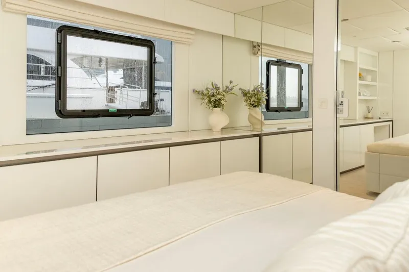 Slide: The Image of Luxurious interior of 2024 Sunreef 80 Power yacht with elegant decor and large window. - 63