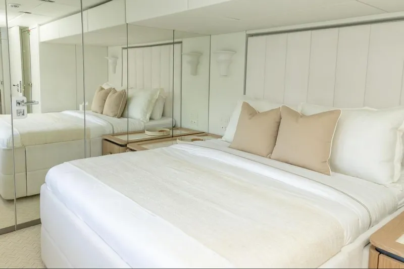 Slide: The Image of Luxurious bedroom interior on 2024 Sunreef 80 Power yacht with elegant bedding and mirrored walls. - 67