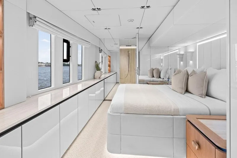Slide: The Image of Luxurious interior of 2024 Sunreef 80 Power yacht, featuring elegant bedroom with panoramic windows. - 80