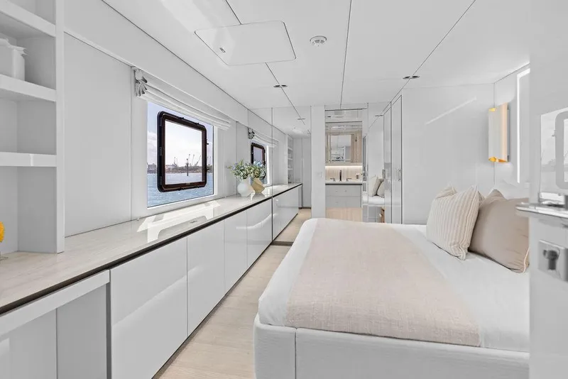 Slide: The Image of Luxurious interior of 2024 Sunreef 80 Power yacht, featuring elegant bedroom with ocean view. - 82