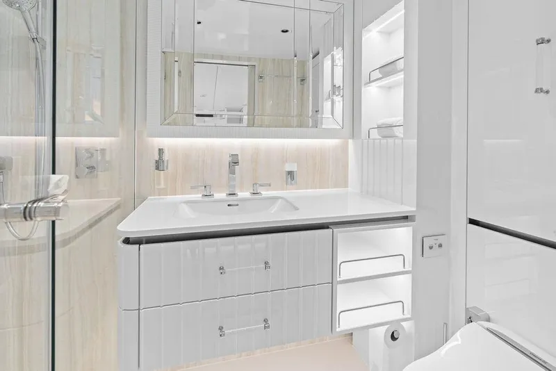 Slide: The Image of Luxurious bathroom interior on 2024 Sunreef 80 Power yacht, featuring sleek white cabinetry and modern fixtures. - 86