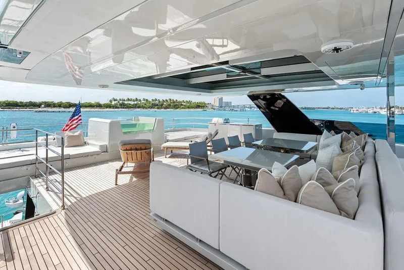 Slide: The Image of Luxurious 2024 Sunreef 80 Power yacht deck with elegant seating, dining area, and ocean view. - 95