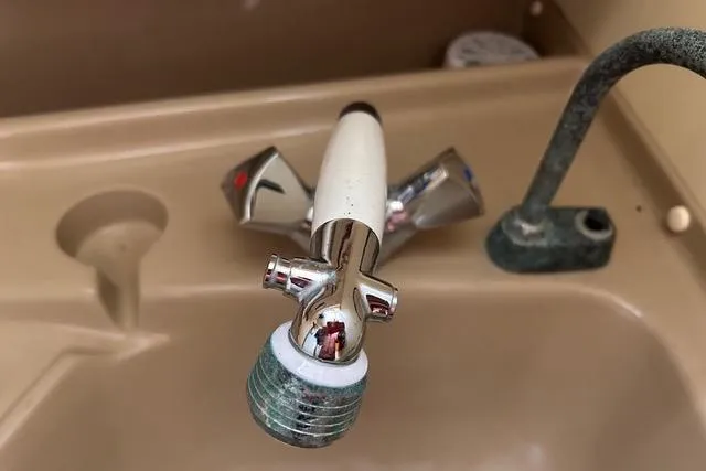 Slide: The Image of 1984 Pearson 34 sailboat cockpit with wooden hatch and circular portholes. - 15