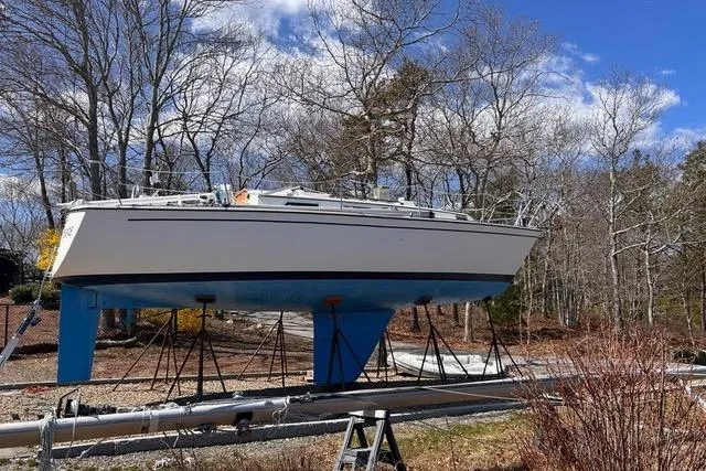Slide: The Image of 1984 Pearson 34 sailboat on calm sea under clear blue sky. - 20