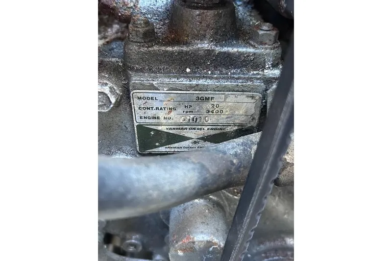 Slide: The Image of Yanmar engine in a 1984 Pearson 34 sailboat, showcasing mechanical components. - 21