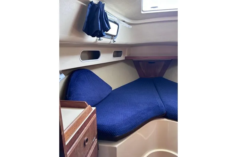 Slide: The Image of Interior cabin of a 1984 Pearson 34 sailboat with blue cushions. - 5
