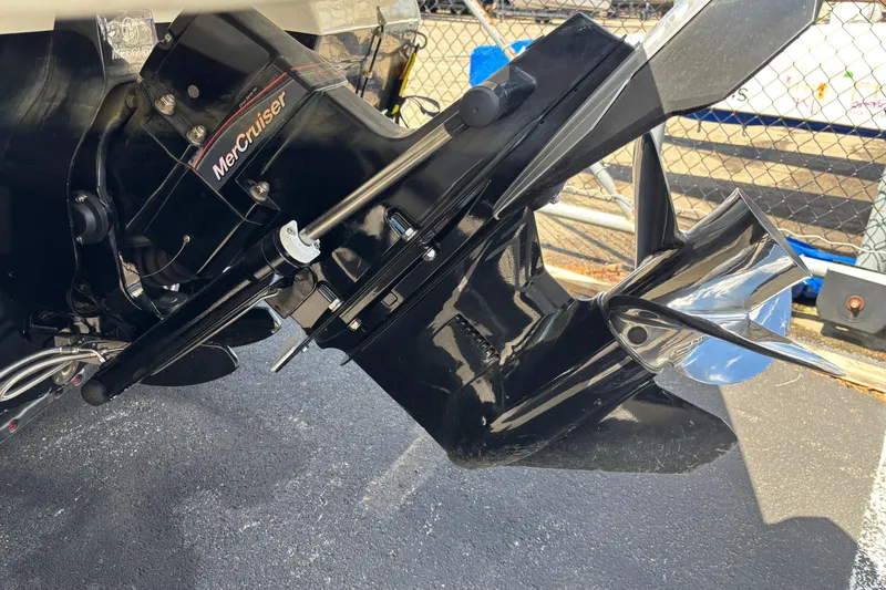 Slide: The Image of 2024 Sea Ray SPX 210 MerCruiser engine close-up, showcasing propeller and drive system. - 4