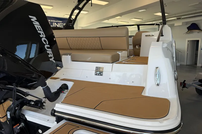 Slide: The Image of 2026 Bayliner D22 boat interior with Mercury engine, featuring tan seating and modern design. - 3