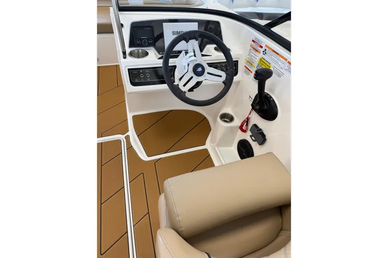 Slide: The Image of 2026 Bayliner D22 boat cockpit with steering wheel and control panel. - 4