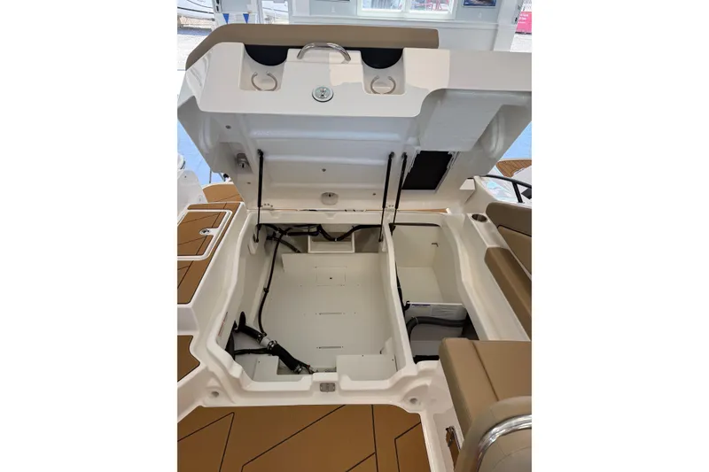 Slide: The Image of Open storage compartment of 2026 Bayliner D22 boat, showcasing interior space and seating. - 8