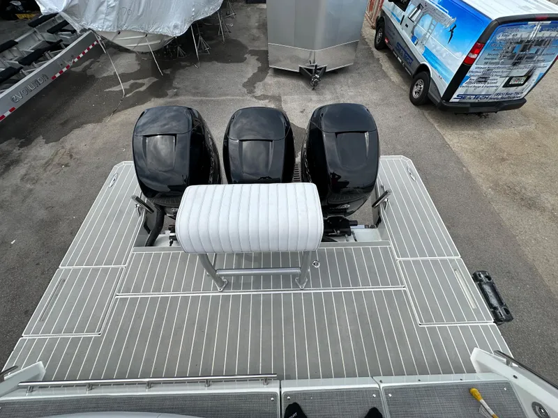 Slide: The Image of 2021 Formula 380 SSC boat with triple outboard engines, rear deck view. - 10