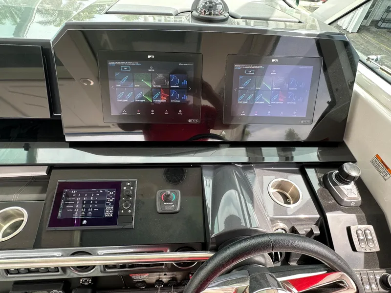 Slide: The Image of 2021 Formula 380 SSC dashboard with dual touchscreen displays and controls. - 19