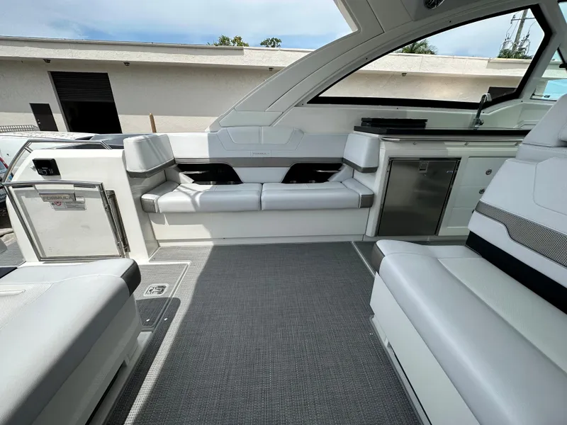Slide: The Image of 2021 Formula 380 SSC boat interior with white seating and modern amenities. - 24