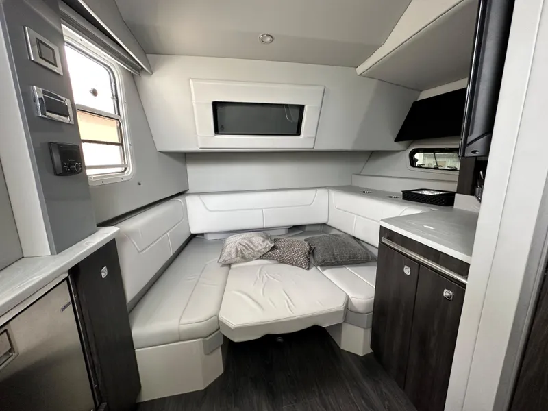 Slide: The Image of Interior cabin of a 2021 Formula 380 SSC boat with modern seating and cabinetry. - 27