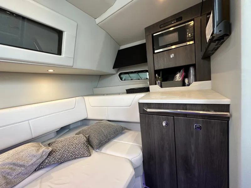 Slide: The Image of 2021 Formula 380 SSC cabin interior with modern kitchenette and cozy seating area. - 28