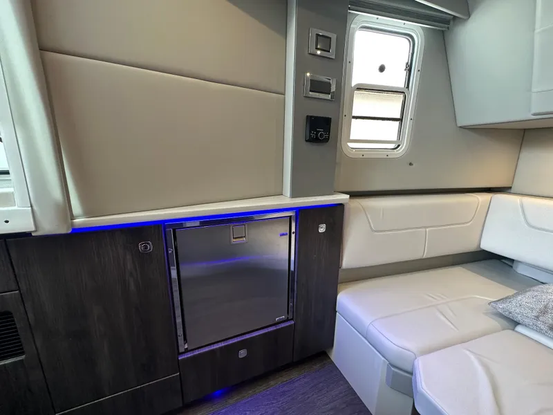 Slide: The Image of Interior of 2021 Formula 380 SSC yacht with modern seating and mini fridge. - 29