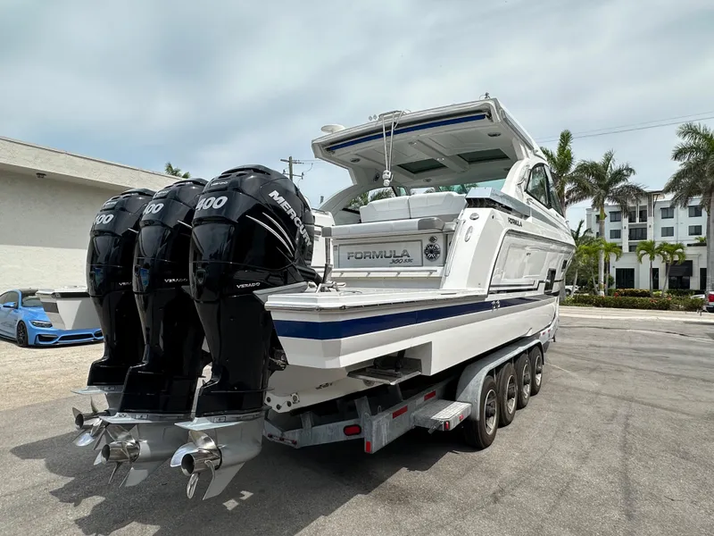 Slide: The Image of 2021 Formula 380 SSC boat with triple Mercury 400 engines on trailer. - 7