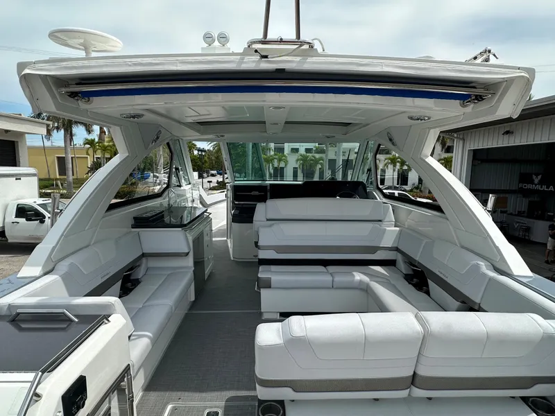 Slide: The Image of 2021 Formula 380 SSC luxury yacht interior with white seating and modern amenities. - 8