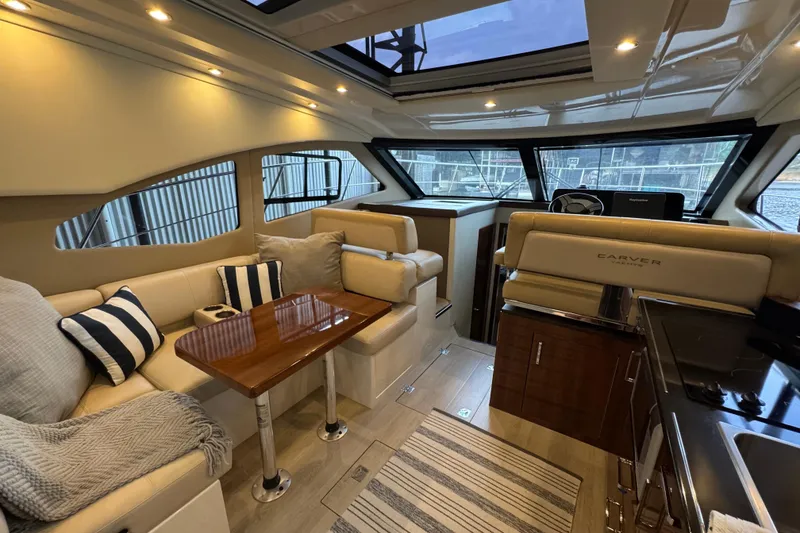 Slide: The Image of Luxurious interior of 2016 Carver C37 Coupe yacht with plush seating and elegant design. - 14