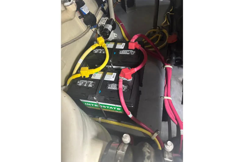 Slide: The Image of Battery compartment of a 2016 Carver C37 Coupe with Interstate batteries and wiring. - 45