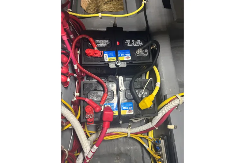 Slide: The Image of Battery compartment of a 2016 Carver C37 Coupe with wiring and connectors. - 46