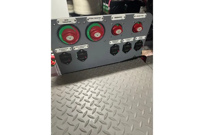 Slide: The Image of Control panel of a 2016 Carver C37 Coupe with labeled switches and diamond plate flooring. - 47